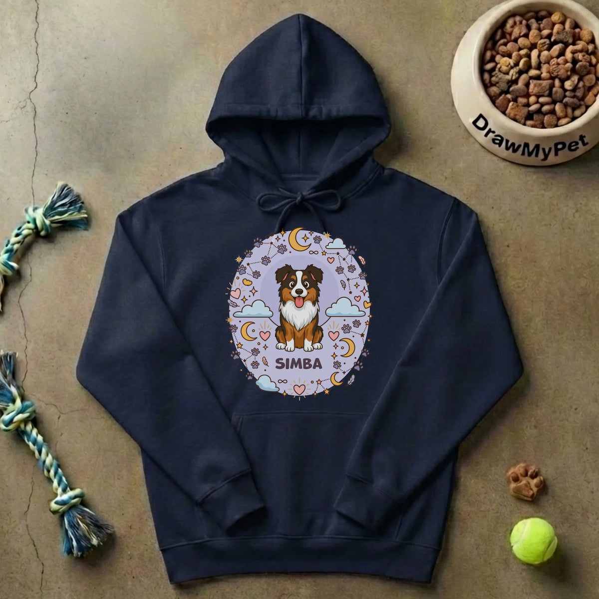 Sudadera con capucha "Amor eterno" sobre fondo rústico con juguetes de perro, simbolizando la comodidad del hogar.