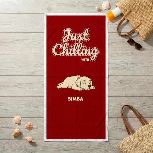 Red personalized towel with sleeping dog "Just Chilling" slogan and pet's name, perfect for beach days.