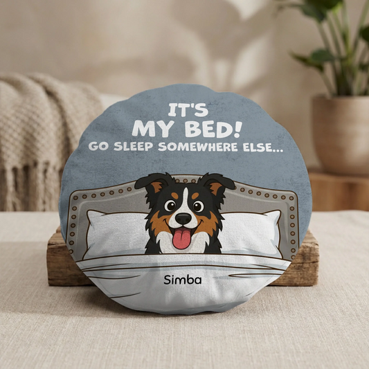 Personalized round cushion with a cartoon dog peeking from bed and 'It's My Bed!' text, for pets.