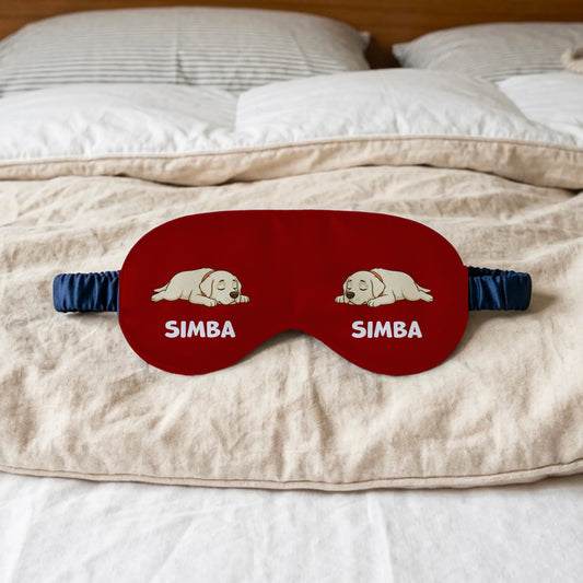 Personalized red sleep mask with sleeping puppy illustrations and pet's name.