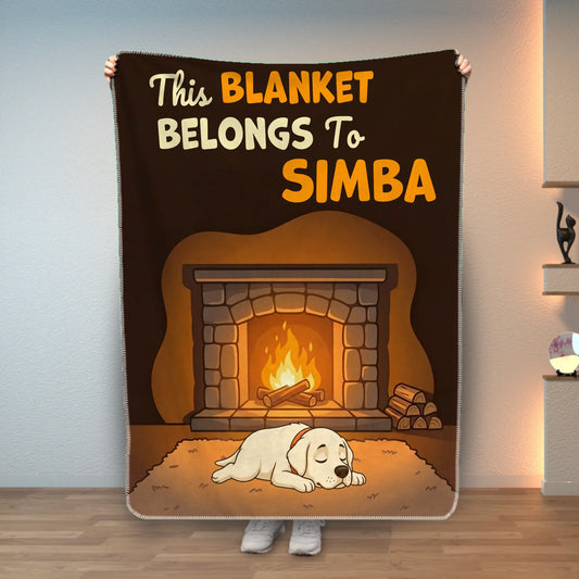 Personalized pet blanket featuring "This blanket belongs to [Pet's Name]" with a sleeping dog by a fireplace.