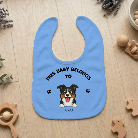Personalized baby bib in light blue with 'This Baby Belongs To' and custom pet portrait.