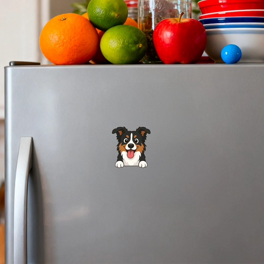 Personalized fridge magnet featuring a joyful cartoon Australian Shepherd peeking over an edge on a silver refrigerator.
