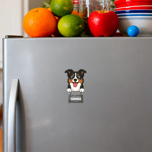 Personalized fridge magnet featuring a joyful cartoon dog holding a "SIMBA" name sign on a metallic fridge.