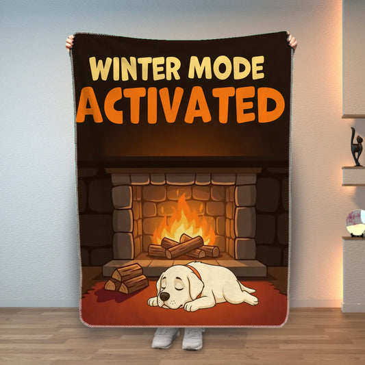 Personalized pet blanket with 'Winter Mode Activated' slogan and a sleeping Labrador by a fireplace.