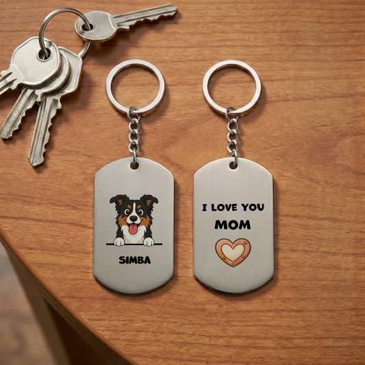 Personalized stainless steel keychain with cartoon dog and 'I Love You Mom' message, keys on a wooden table.