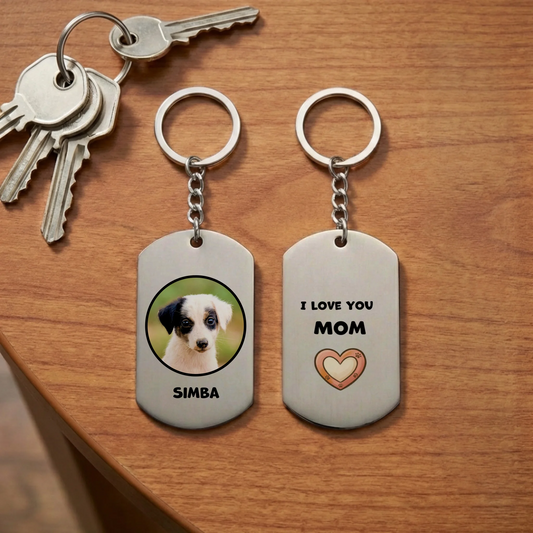 Personalized 'I Love You Mom' stainless steel keychain with photo of a cute puppy and pet's name on wooden table with keys.