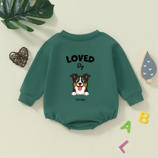 Green personalized baby bodysuit "Loved By" a cute cartoon dog named Simba, laying flat.