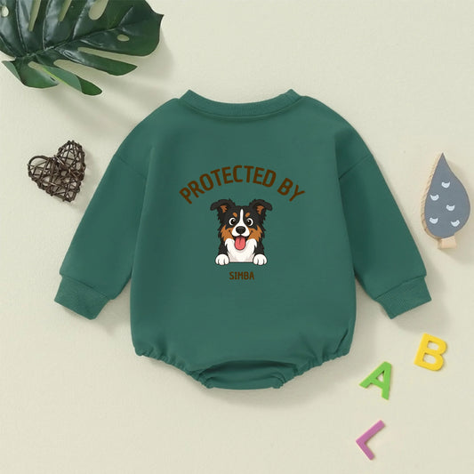 Personalized green baby bodysuit with a happy Australian Shepherd dog illustration and 'Protected By' text.