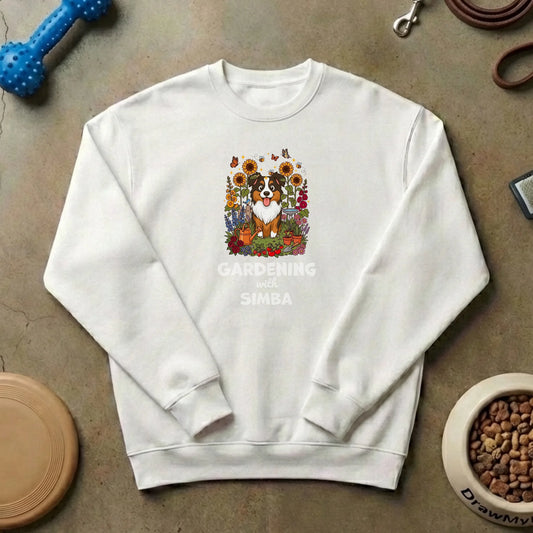 Personalized white sweatshirt featuring a happy Australian Shepherd dog in a vibrant garden with 'Gardening with [Pet's Name]' text from Draw My Pets.