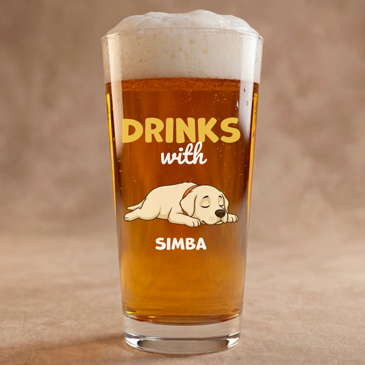 Personalized beer glass with a sleeping Labrador dog and 'Drinks with Simba' text