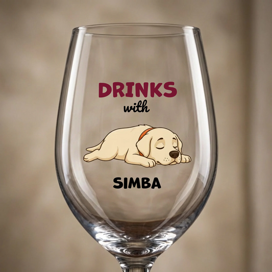 Personalized wine glass with a sleeping dog portrait and 'Drinks with Simba' text