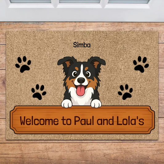 Personalized doormat with 'Welcome to [Family Name]'s' text, featuring a cheerful cartoon Australian Shepherd dog and paw prints at a home entrance.